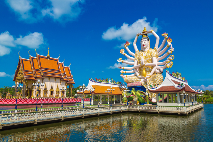 Statue of Shiva in Wat Plai Laem Temple, Samui, Thailand in a summer day