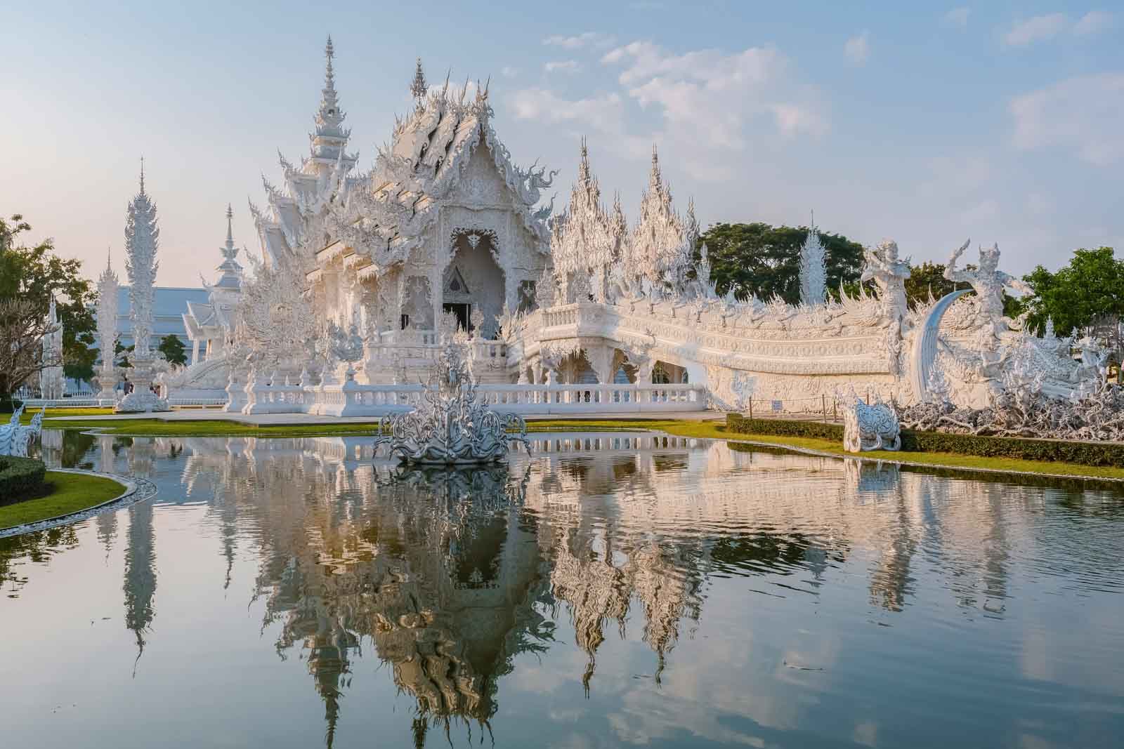 White Temple Chiang Rai Thailand with reflection in the water, Wat Rong Khun or White Temple, Chiang Rai, Northern Thailand.