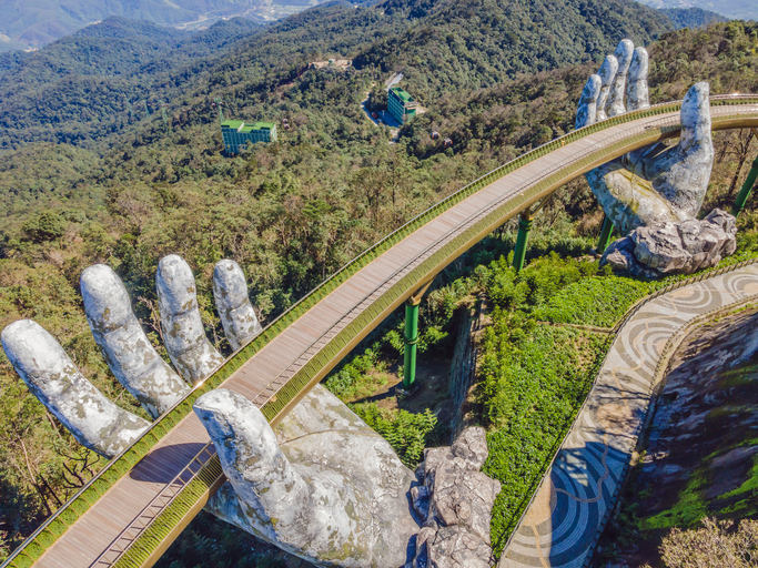 Da Nang, Vietnam, 28 december 2020: Famous tourist attraction - Golden bridge at the top of the Ba Na Hills, Vietnam.