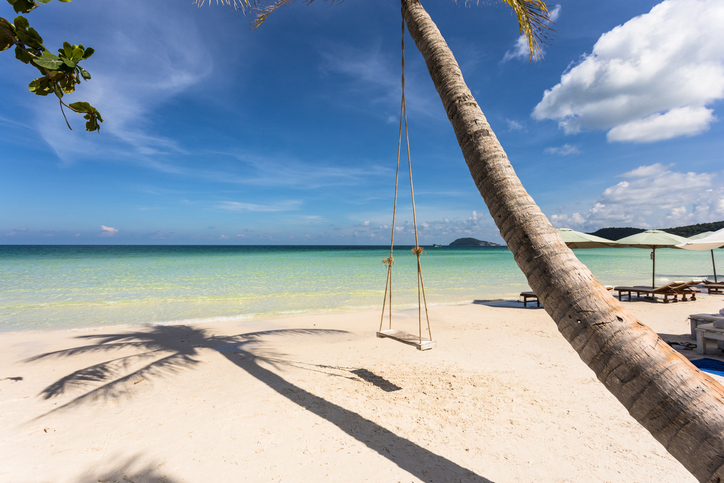 Swing attached to a palm tree in the idyllic Bai Sao beach in Phu Quoc island in Vietnam in the Gulf of Thailand.
